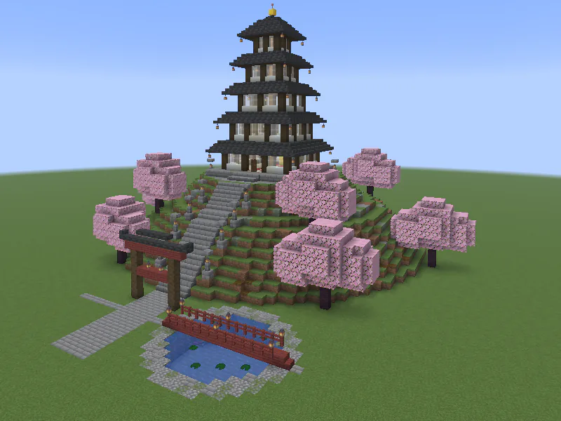 Multi-tiered Japanese pagoda on a hill, with upswept roofs.